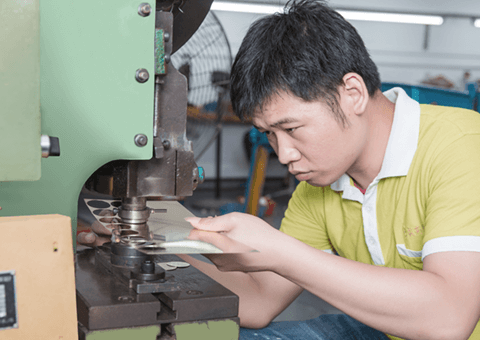 Workers-concentrating-on-processing-dials